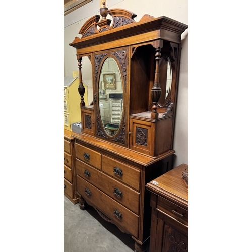 1590 - An Edwardian drawer based cabinet with mirror back.