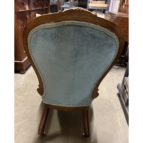 1592 - A Victorian nursing chair with blue Draylon deep buttoned back