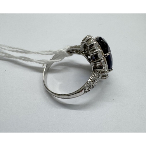 1100C - A Tanzanite CZ set in silver (0.925 marked) 1 stone missing.