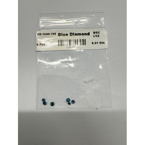 1100E - A quantity of loose gems including blue and black diamonds