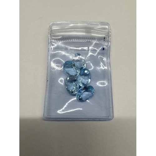 1100E - A quantity of loose gems including blue and black diamonds