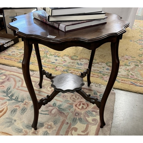 1633 - An Edwardian mahogany tea table with shaped rim