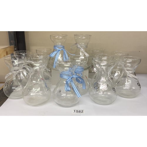 1582 - A quantity of glass posy holders (ideal for a cafe)