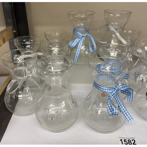 1582 - A quantity of glass posy holders (ideal for a cafe)