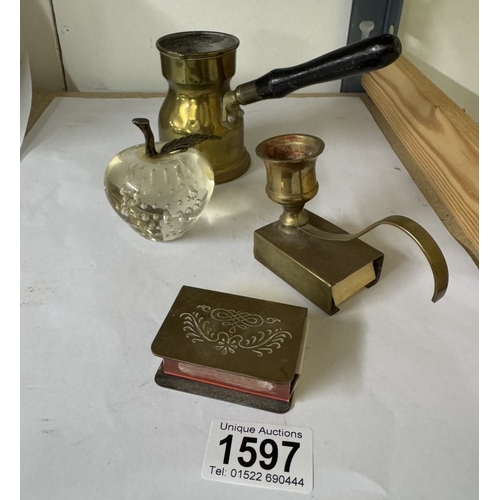 1597 - A brass chamber candlestick, matchbook holder & glass apple paperweight etc.