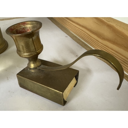 1597 - A brass chamber candlestick, matchbook holder & glass apple paperweight etc.