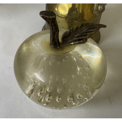 1597 - A brass chamber candlestick, matchbook holder & glass apple paperweight etc.