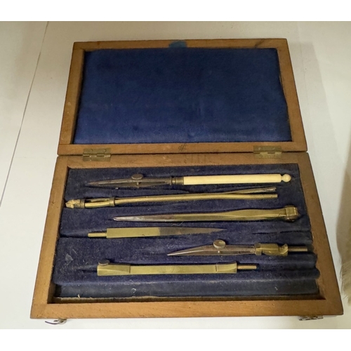 1601 - A shelf of miscellaneous collectables including barometer, geometry set & tie press etc.