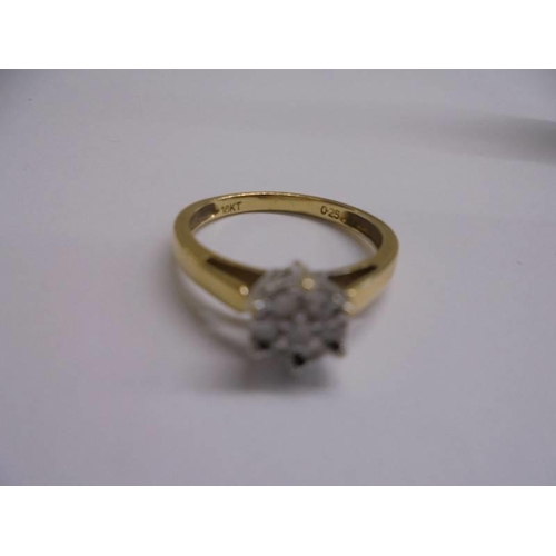 1004 - An 18ct yellow gold seven stone diamond ring, size P, 3.53 grams