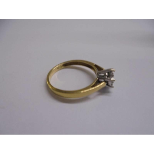 1004 - An 18ct yellow gold seven stone diamond ring, size P, 3.53 grams