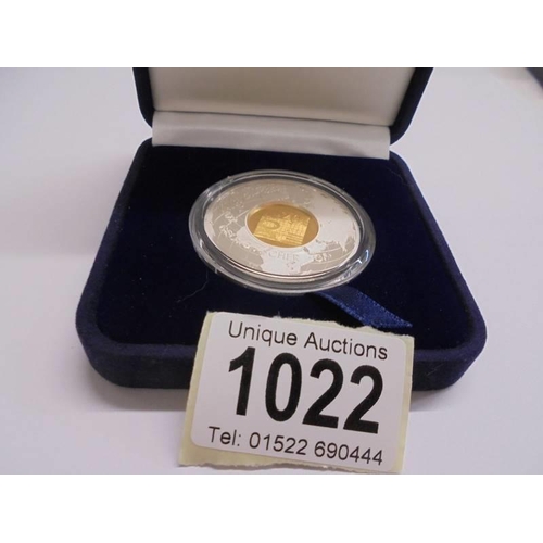 1022 - A Georg Fisher gold and silver medallion, 5 grams of 14ct gold and 31 grams of silver.