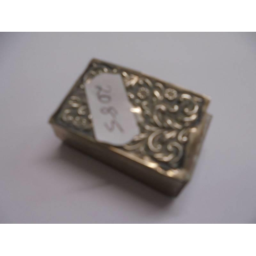 1023 - A silver watch chain, a silver heart shaped vesta case and a silver match box holder,