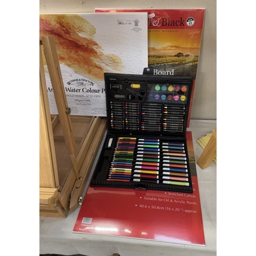 1806 - An artists easel & storage box plus artists paper, boards, colour pens, paints & pastels etc.