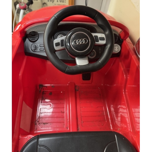 1834 - A Childs Audi RS TT Plus electric sit in car (Needs battery & leads)