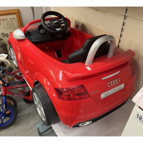 1834 - A Childs Audi RS TT Plus electric sit in car (Needs battery & leads)