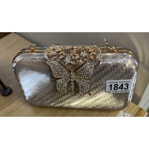 1843 - A decorative gold & silver ladies clutch / bag with butterfly diamante latch