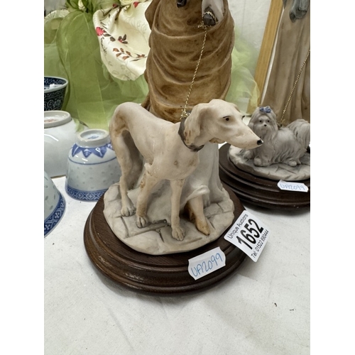 1652 - A pair of lady figurines with dogs