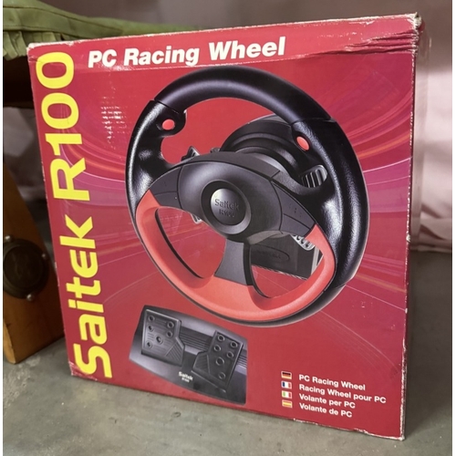 1658 - A boxed Saitek R100 P.C. racing wheel