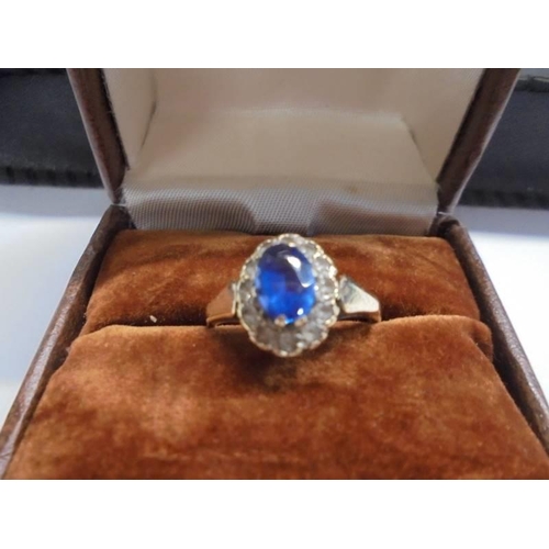 1031 - A 9ct gold diamond and sapphire ring, size N half, 2.4 grams.