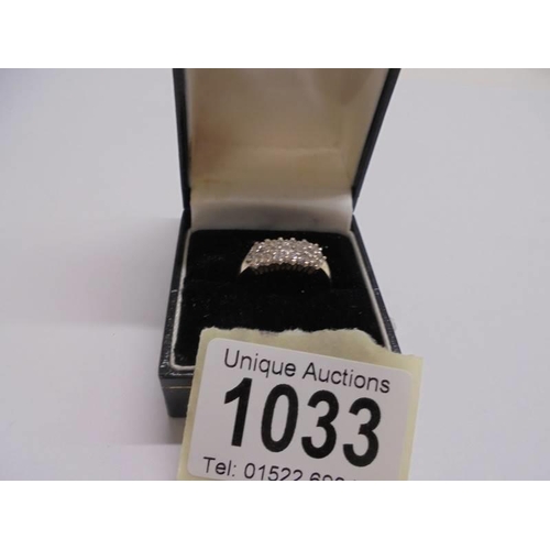 1033 - A 14ct gold diamond ring (with approximatley 19 stones), size Q, 3.45 grams.