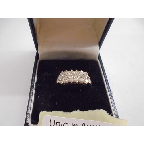 1033 - A 14ct gold diamond ring (with approximatley 19 stones), size Q, 3.45 grams.