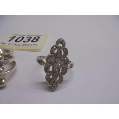 1038 - Four assorted silver dress rings.