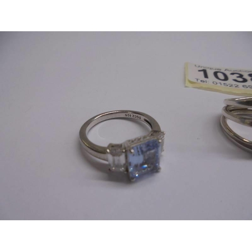 1038 - Four assorted silver dress rings.