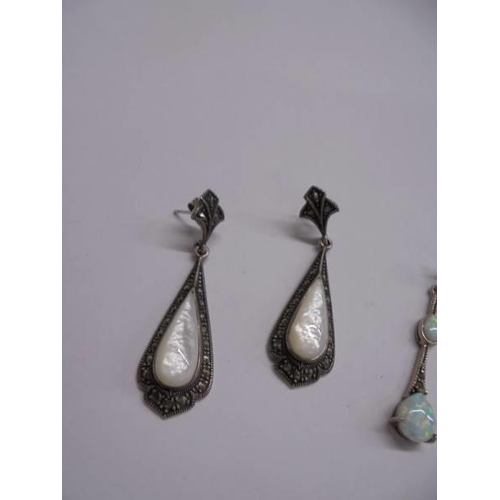 1041 - Two pairs of silver pendant earrings.