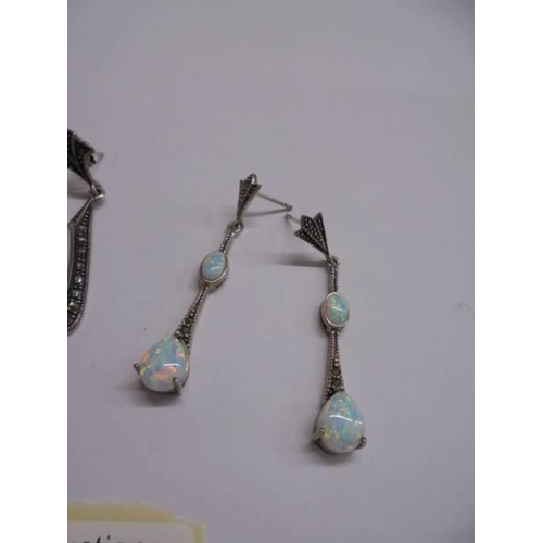 1041 - Two pairs of silver pendant earrings.