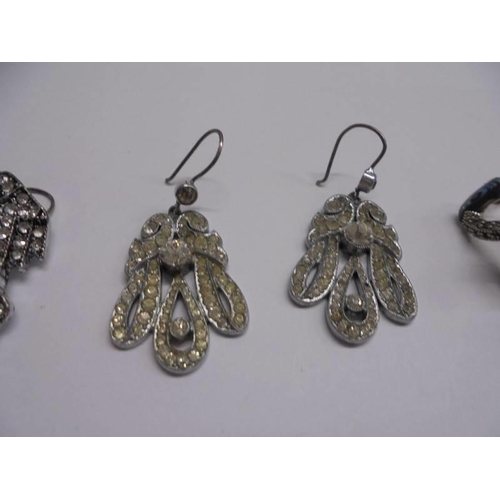 1044 - Nine pairs of assorted fashion earrings.