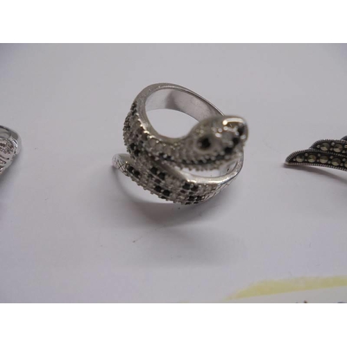 1045 - A silver snake ring, a silver kingfisher ring and a silver marcasite ring.