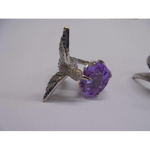 1045 - A silver snake ring, a silver kingfisher ring and a silver marcasite ring.