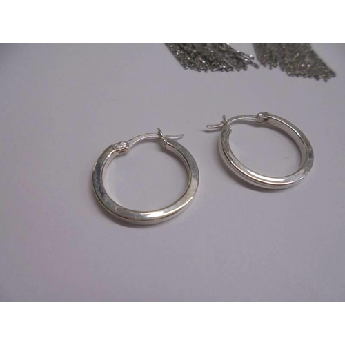 1047 - Ten pairs of white metal fashion earrings.