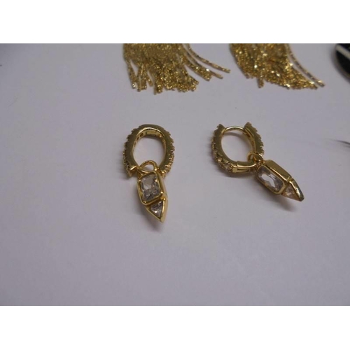 1048 - Six pair of yellow metal fashion earrings.