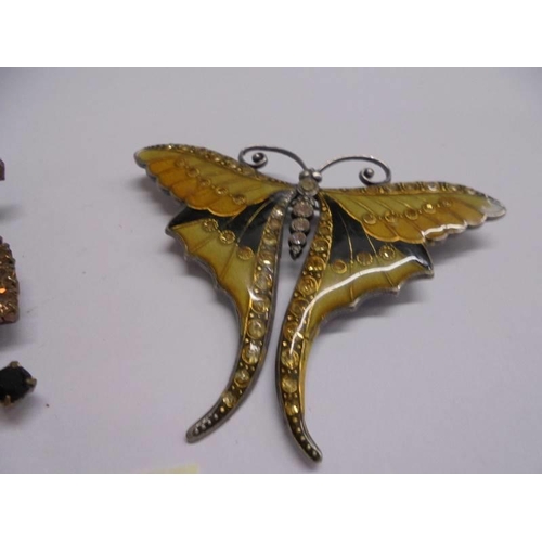 1055 - Two stone set insect fashion brooches.