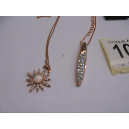 1060 - A yellow metal Swarovski crystal pendant and another pendent marked 925.