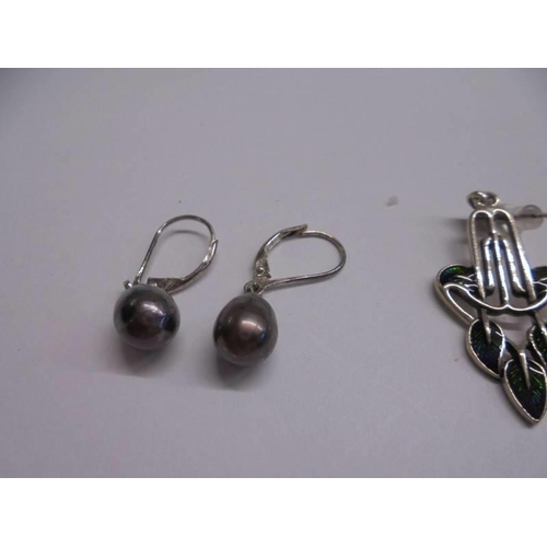 1066 - Two pairs of silver earrings and a pair of yellow metal earrings.