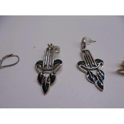 1066 - Two pairs of silver earrings and a pair of yellow metal earrings.