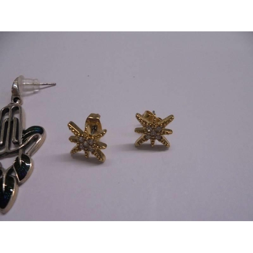 1066 - Two pairs of silver earrings and a pair of yellow metal earrings.