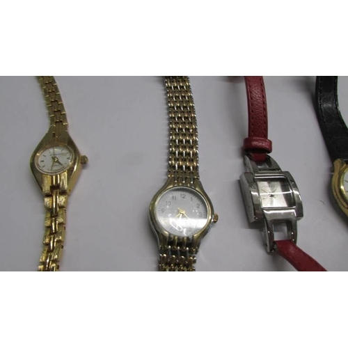 1074 - Eight ladies watches including Limit, Gucci, Citron, Accurist. etc.,