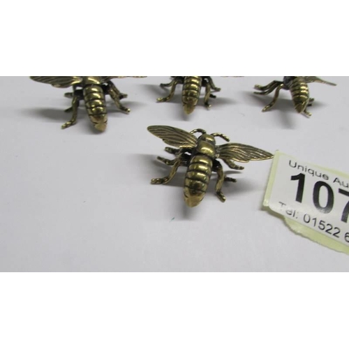 1078 - Four unusual brass bees.