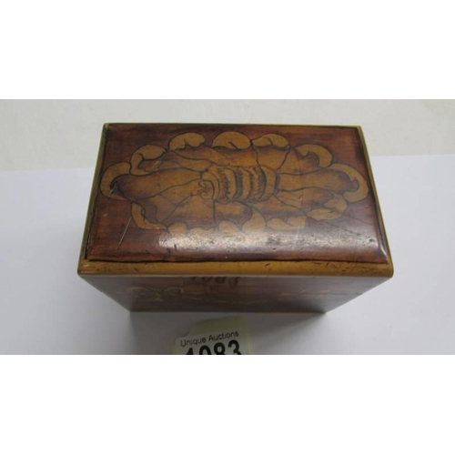 1083 - A nice inlaid playing card box with cards.