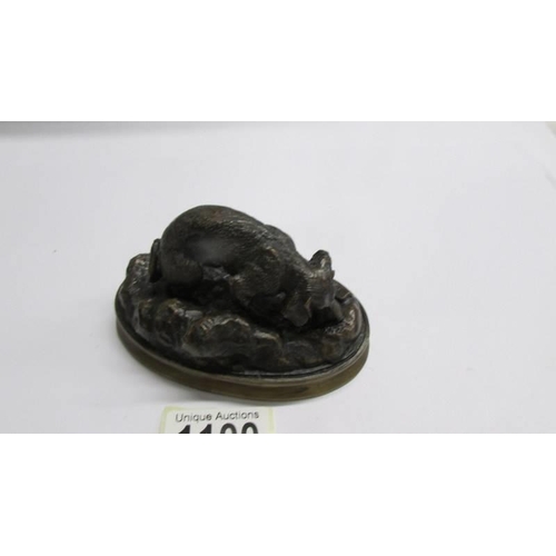 1100 - A bronze dog figure signed Mougmley.