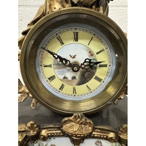 1740F - A 19th century gilt mantel clock surmounted figure with painted porcelain panels.