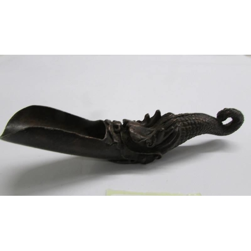 1122 - A signed Chinese bronze feeding spoon.