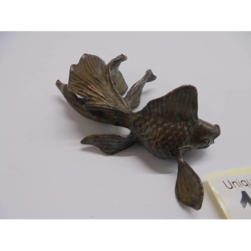 1124 - A signed Chinese bronze Koi carp.