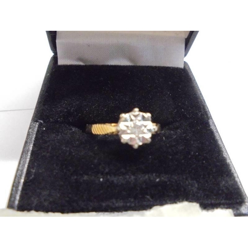 1127 - A diamond single stone ring circa 1970/80's, textured shoulders in 18ct gold, Birmingham hall mark, ... 