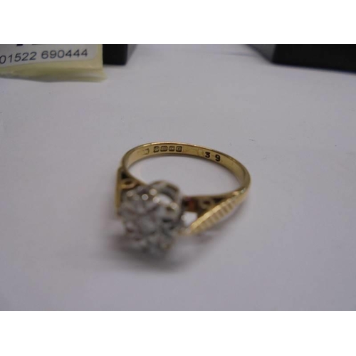 1127 - A diamond single stone ring circa 1970/80's, textured shoulders in 18ct gold, Birmingham hall mark, ... 