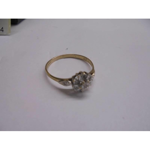 1130 - A vintage diamond cluster ring in 9ct gold, Birmingham hall mark, size N half, 1.3 grams.