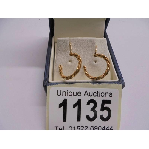 1135 - A pair of 9ct gold hoop earrings, 1.63 grams.